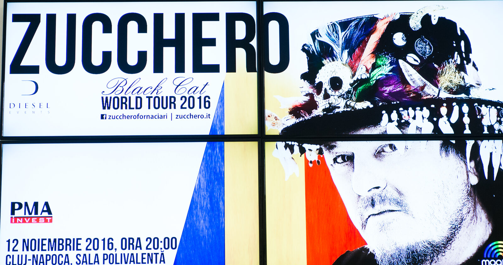A tiled video wall plays a full-bleed concert campaign as one large image.